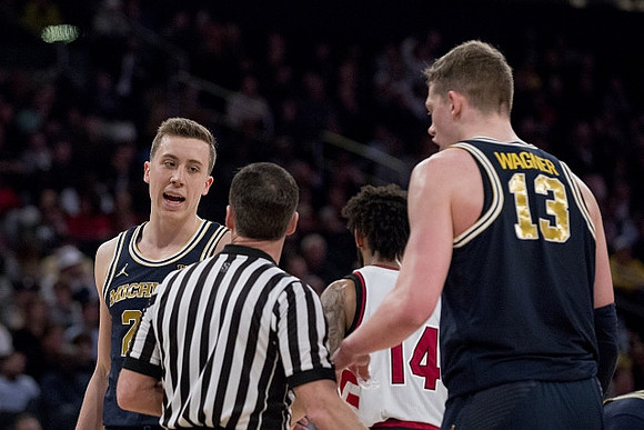 Duncan Robinson (22) and Moritz Wagner (13)