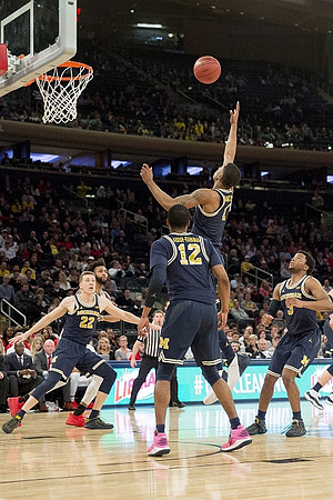 Duncan Robinson (22), Muhammad-Ali Abdur-Rahkman (12), Charles Matthews (1), and Zavier Simpson (3)