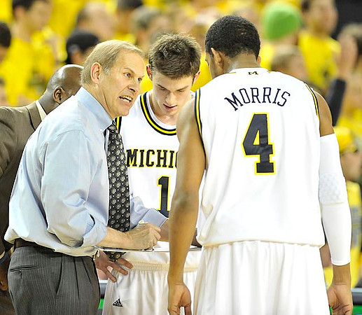 John Beilein, Stu Douglass (1), and Darius Morris (4)