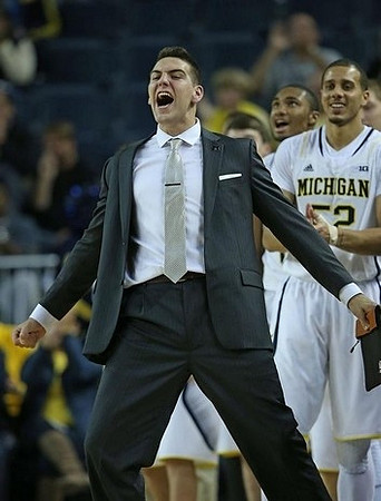 Mitch McGary (4) and Jordan Morgan (52)