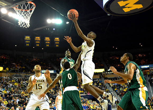 Jon Horford (15) and Caris LeVert (23)
