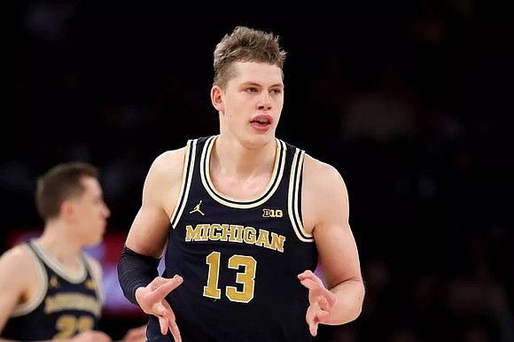 Moritz Wagner (13) and Duncan Robinson (22)