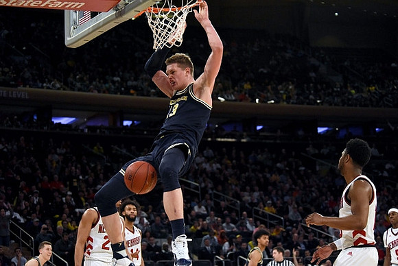 Duncan Robinson (22), Moritz Wagner (13), and Ibi Watson (23)