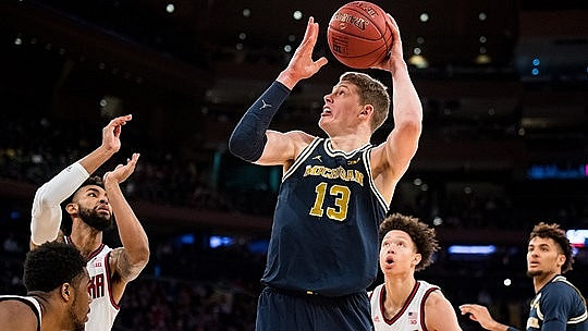 Moritz Wagner (13) and Isaiah Livers (4)