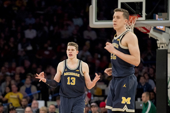 Moritz Wagner (13) and Duncan Robinson (22)