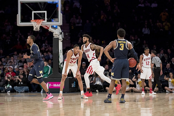 Muhammad-Ali Abdur-Rahkman (12) and Zavier Simpson (3)