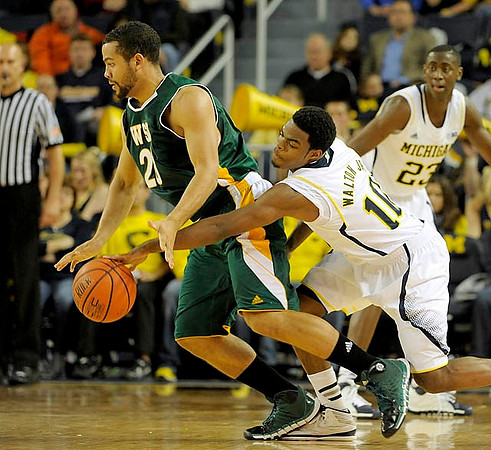 Derrick Walton Jr. (10) and Caris LeVert (23)