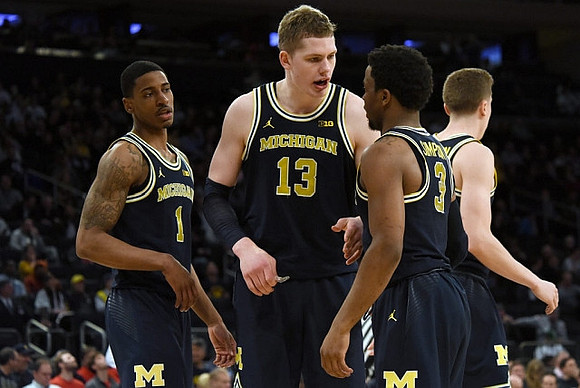 Charles Matthews (1), Moritz Wagner (13), Zavier Simpson (3), and Duncan Robinson (22)