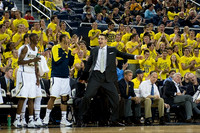Caris LeVert (23), Jon Horford (15), Mitch McGary (4), Jeff Meyer, John Beilein, and Gary Moeller