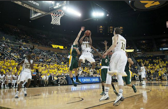 Caris LeVert (23), Glenn Robinson III (1), and Nik Stauskas (11)