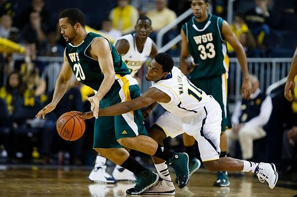 Derrick Walton Jr. (10) and Caris LeVert (23)