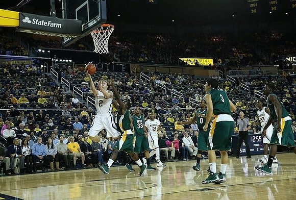 Spike Albrecht (2), Zak Irvin (21), and Caris LeVert (23)