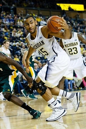 Jon Horford (15) and Caris LeVert (23)