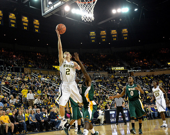 Spike Albrecht (2) and Caris LeVert (23)
