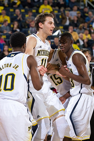Derrick Walton Jr. (10), Nik Stauskas (11), Jon Horford (15), and Caris LeVert (23)