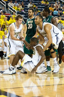 Spike Albrecht (2), Caris LeVert (23), and Jon Horford (15)