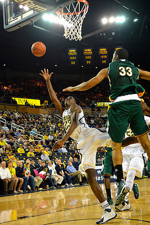 Caris LeVert (23) and Jordan Morgan (52)