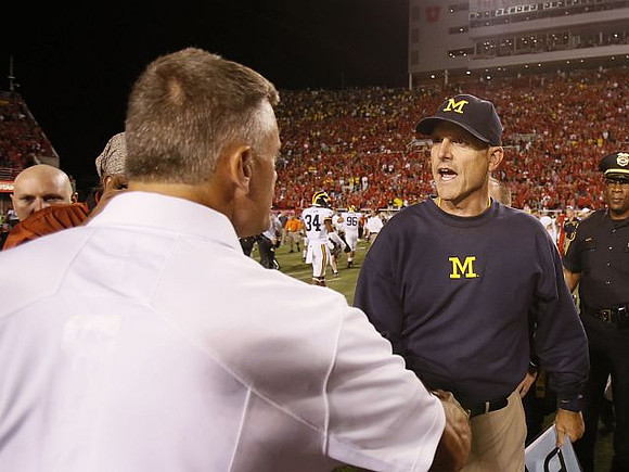 Utah Head Coach Kyle Whittingham and Jim Harbaugh