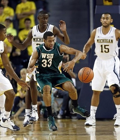 Caris LeVert (23) and Jon Horford (15)