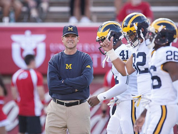 Jim Harbaugh, Brian Cole (41), Ty Isaac (32), and Jourdan Lewis (26)