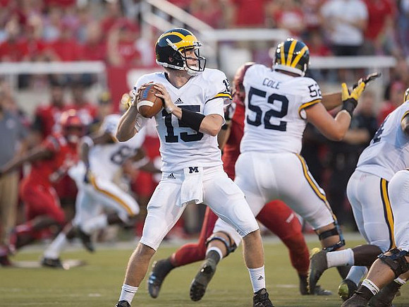 Jake Rudock (15) and Mason Cole (52)