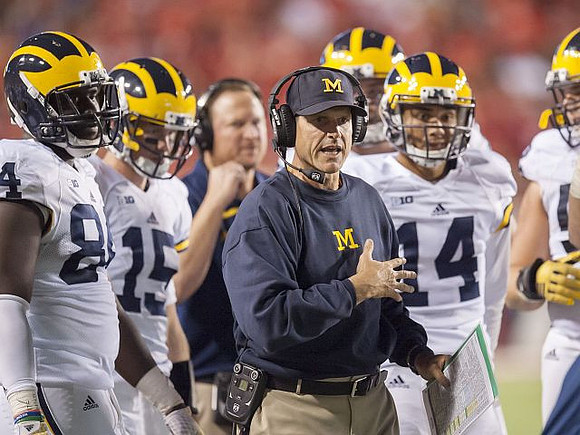 A.J. Williams (84), Jake Rudock (15), Jim Harbaugh, and Drake Harris (14)