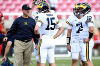 Jim Harbaugh, Jake Rudock (15), Shane Morris (7), and Alex Malzone (12)