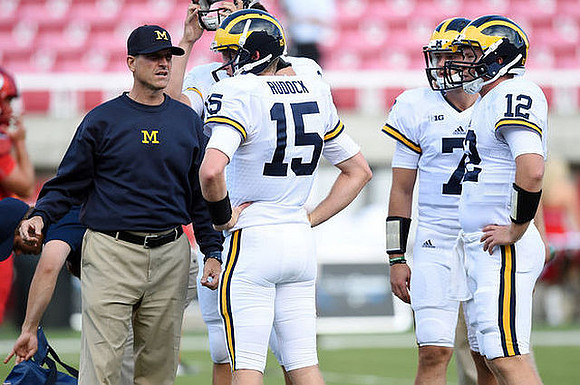 Jim Harbaugh, Jake Rudock (15), Shane Morris (7), and Alex Malzone (12)