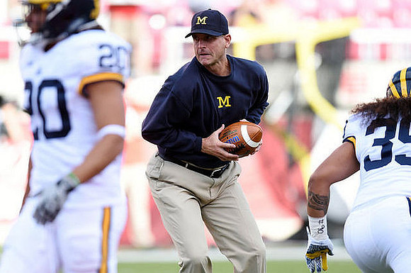 Drake Johnson (20), Jim Harbaugh, and Sione Houma (39)