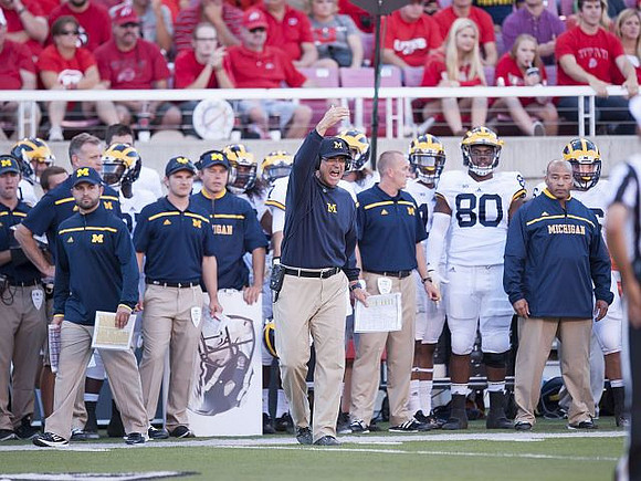 Jim Harbaugh and Khalid Hill (80)