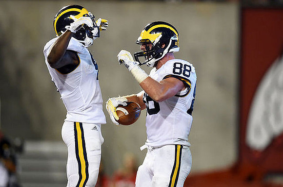 De'Veon Smith (4) and Jake Butt (88)