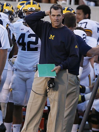 Ben Gedeon (42) and Jim Harbaugh