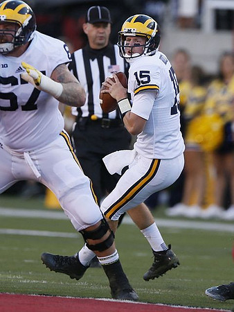 Kyle Kalis (67) and Jake Rudock (15)