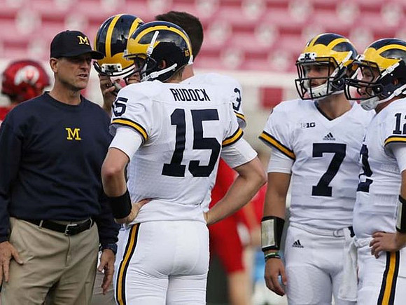 Jim Harbaugh, Jake Rudock (15), Shane Morris (7), and Alex Malzone (12)