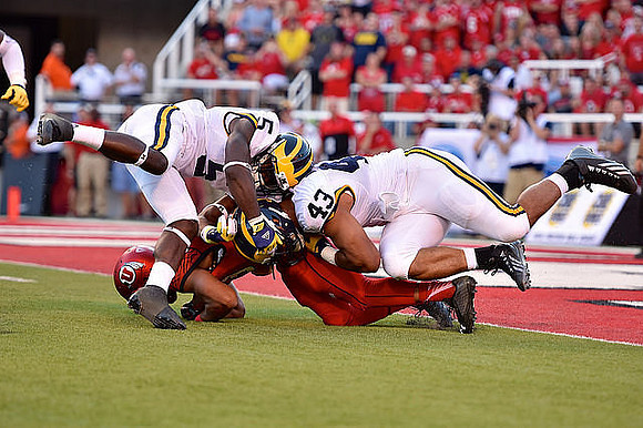 Jabrill Peppers (5) and Chris Wormley (43)