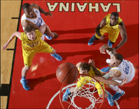 Evan Smotrycz (23), Zack Novak (0), and Tim Hardaway Jr. (10)