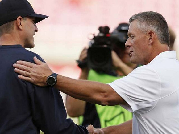 Jim Harbaugh and Utah Head Coach Kyle Whittingham