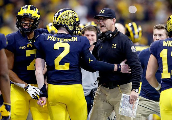 Tarik Black (7), Shea Patterson (2), and Jim Harbaugh