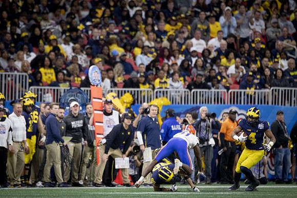 Jim Harbaugh, Grant Perry (88), and Nico Collins (4)