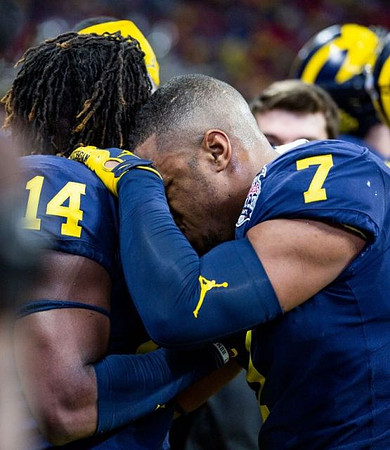 Josh Metellus (14) and Khaleke Hudson (7)