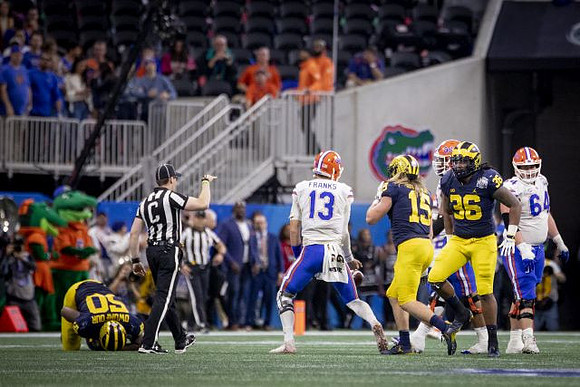 Michael Dwumfour (50), Chase Winovich (15), and Devin Gil (36)