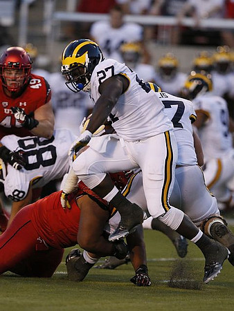 Jake Butt (88), Derrick Green (27), and Kyle Kalis (67)