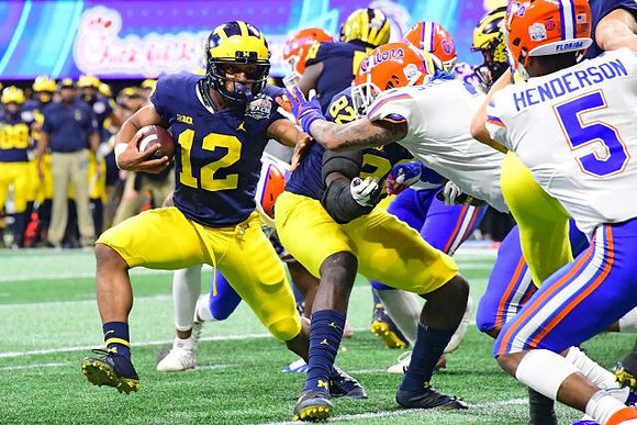 Chris Evans (12), Nick Eubanks (82), and Cesar Ruiz (51)