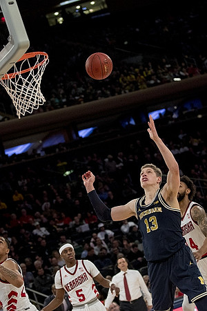 Moritz Wagner (13) and Nebraska Head Coach Tim Miles