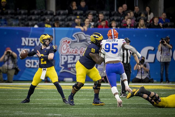 Shea Patterson (2) and Cesar Ruiz (51)