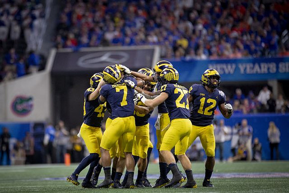 Jake McCurry (43), Khaleke Hudson (7), Joe Hewlett (27), and Josh Ross (12)