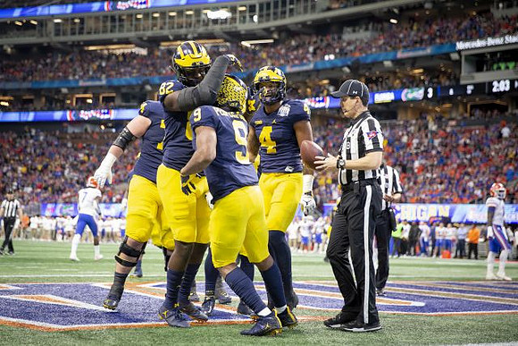 Ben Bredeson (74), Nick Eubanks (82), Donovan Peoples-Jones (9), and Nico Collins (4)