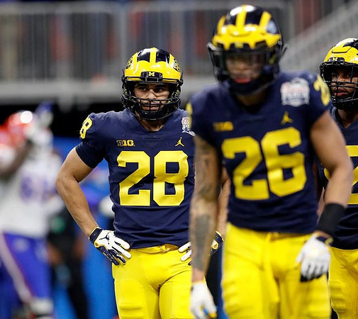 Brandon Watson (28) and J'Marick Woods (26)