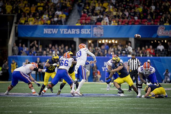 Chris Evans (12), Shea Patterson (2), and Jon Runyan Jr. (75)