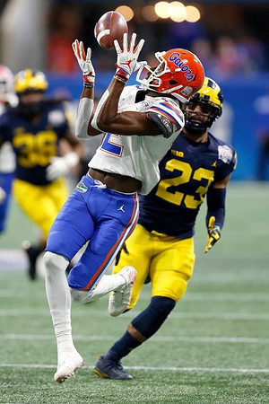 Tyree Kinnel (23) and Devin Gil (36)
